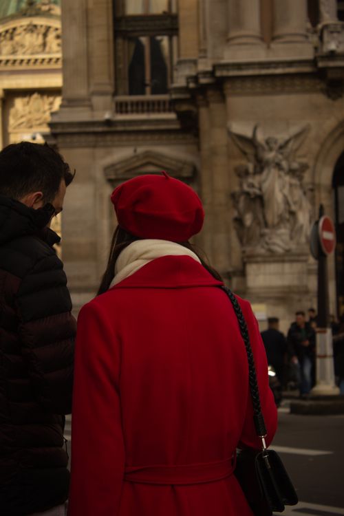 Free A couple exploring the charming streets of Paris in stylish winter attire. Stock Photo