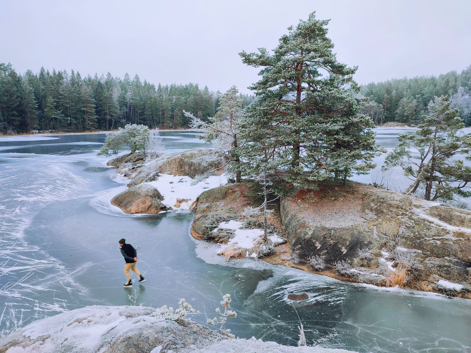 Man Skiing on Frozen Lake