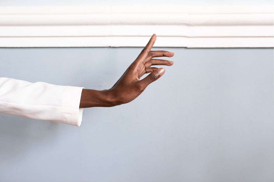 person pressing wrist pressure point relaxation