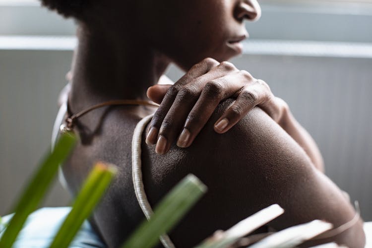 Woman Touching Shoulder