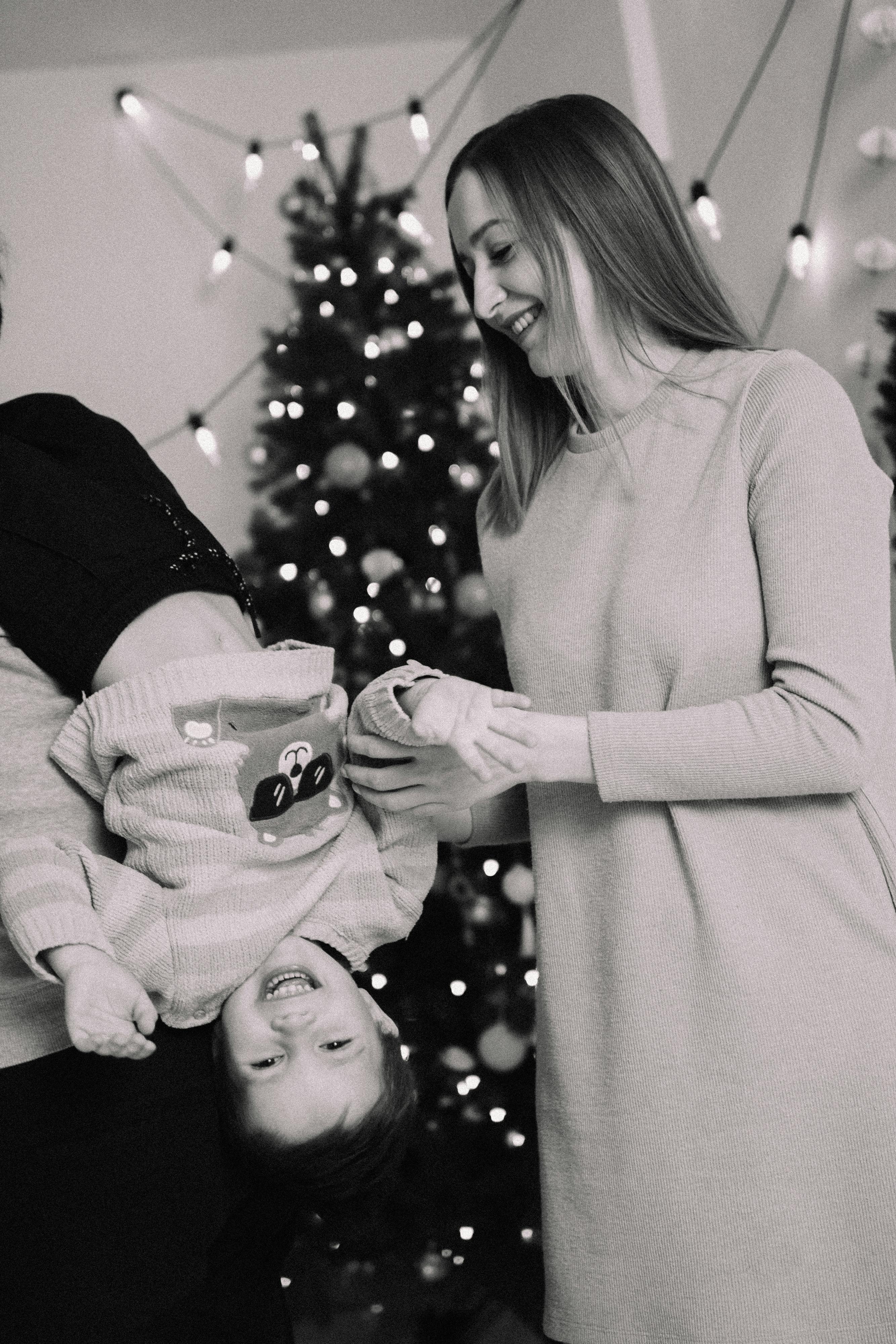 smiling mother playing with son