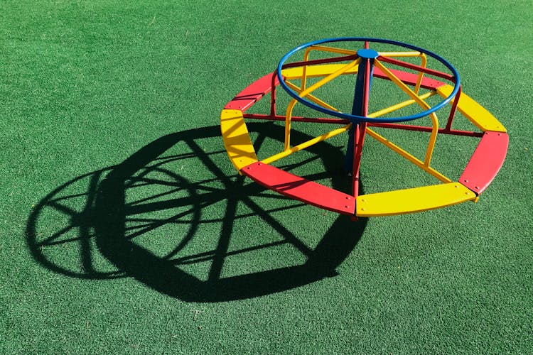 Playground Equipment On Green Grass