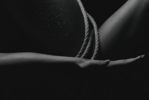 Grayscale Photography of Rope on Human Skin
