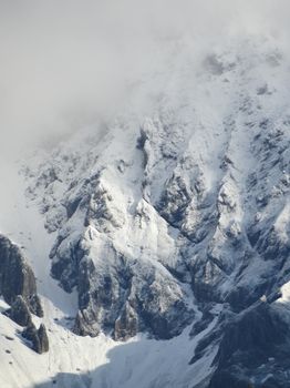 A breathtaking view of snow-covered mountains in Schladming, Austria, capturing winter's beauty.