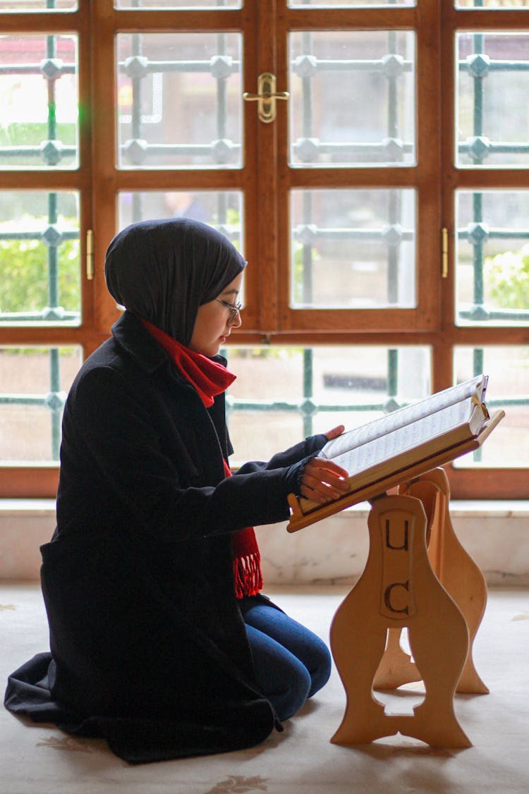 Woman Reading Religious Book