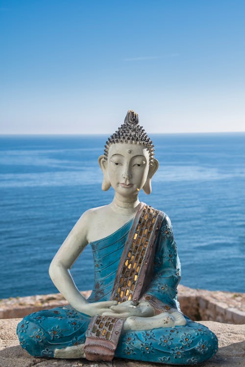 Buddha Statue Against Sea