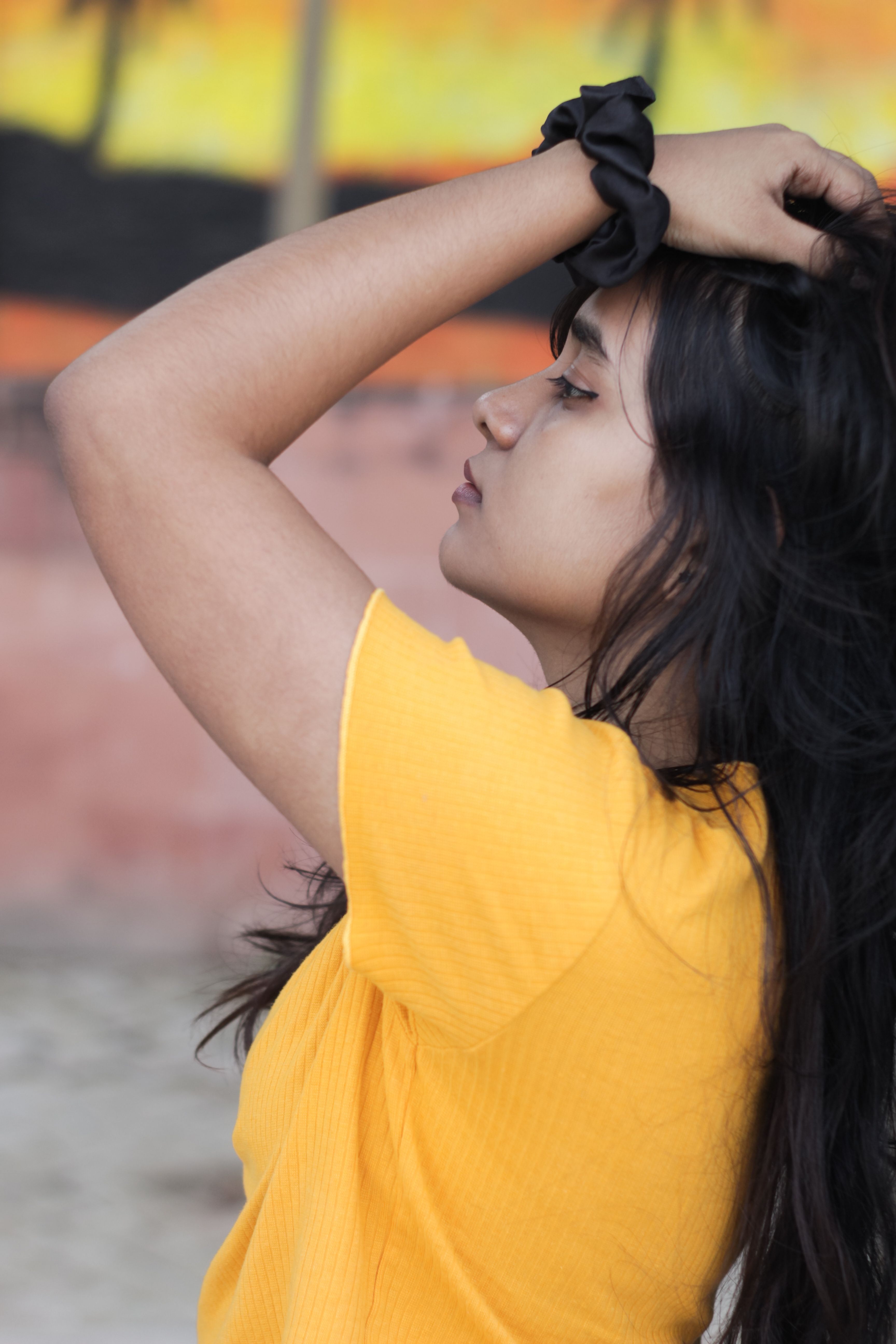 Side View of a Girl Touching Her Hair · Free Stock Photo