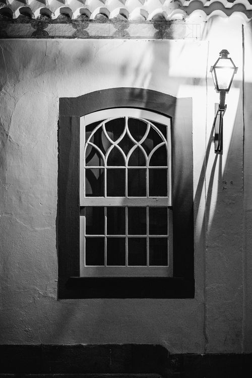 Free Elegant colonial window and lamp in Tiradentes, MG, Brasil, in black and white. Stock Photo