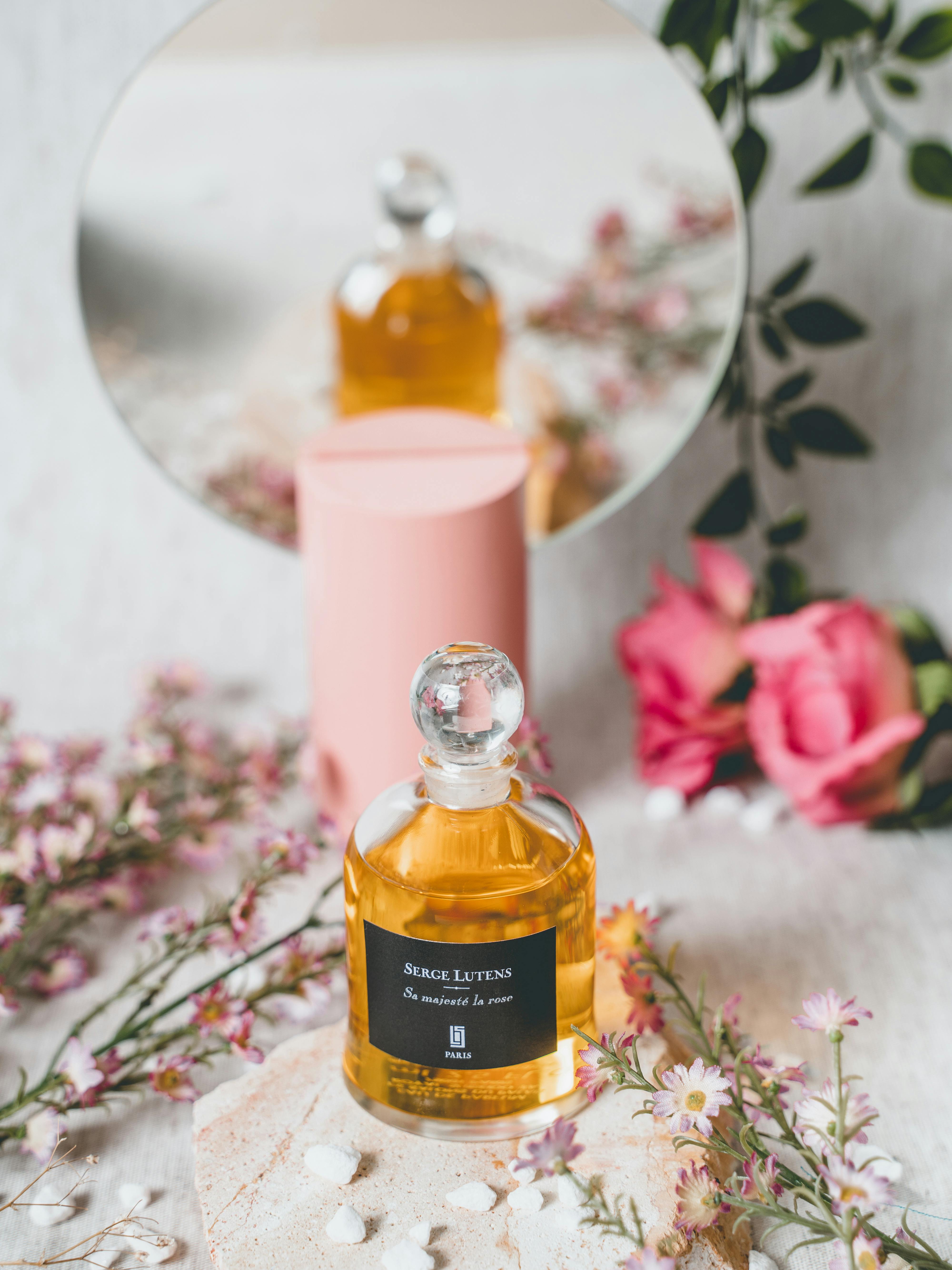 Glass Bottle of Pink Perfume · Free Stock Photo