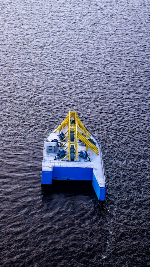 An aerial view of a small boat in the water
