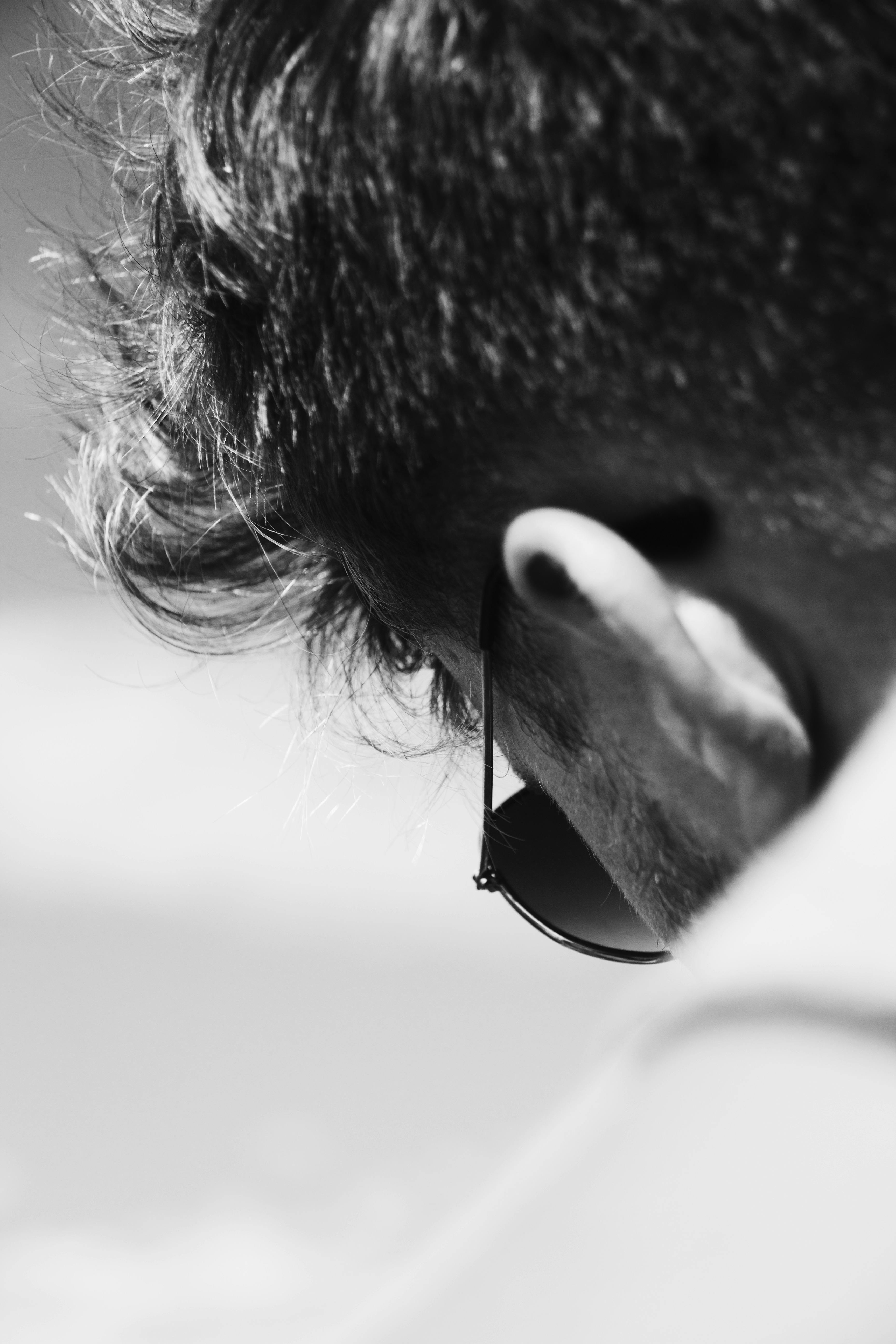 black and white shot of the ear of a man