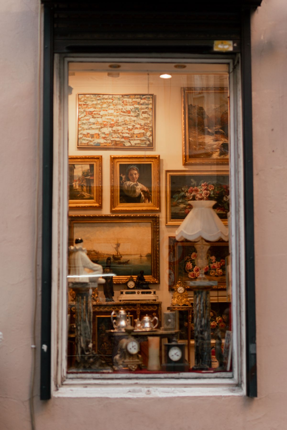 Shelves of antiques inside a vintage curiosity shop