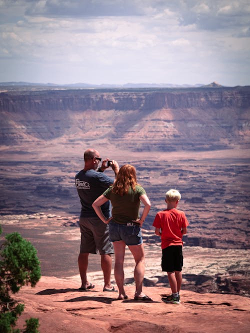 A Family on Top of a Brown Hill