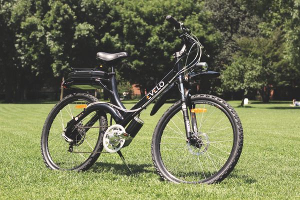 Modern electric bike parked on grass