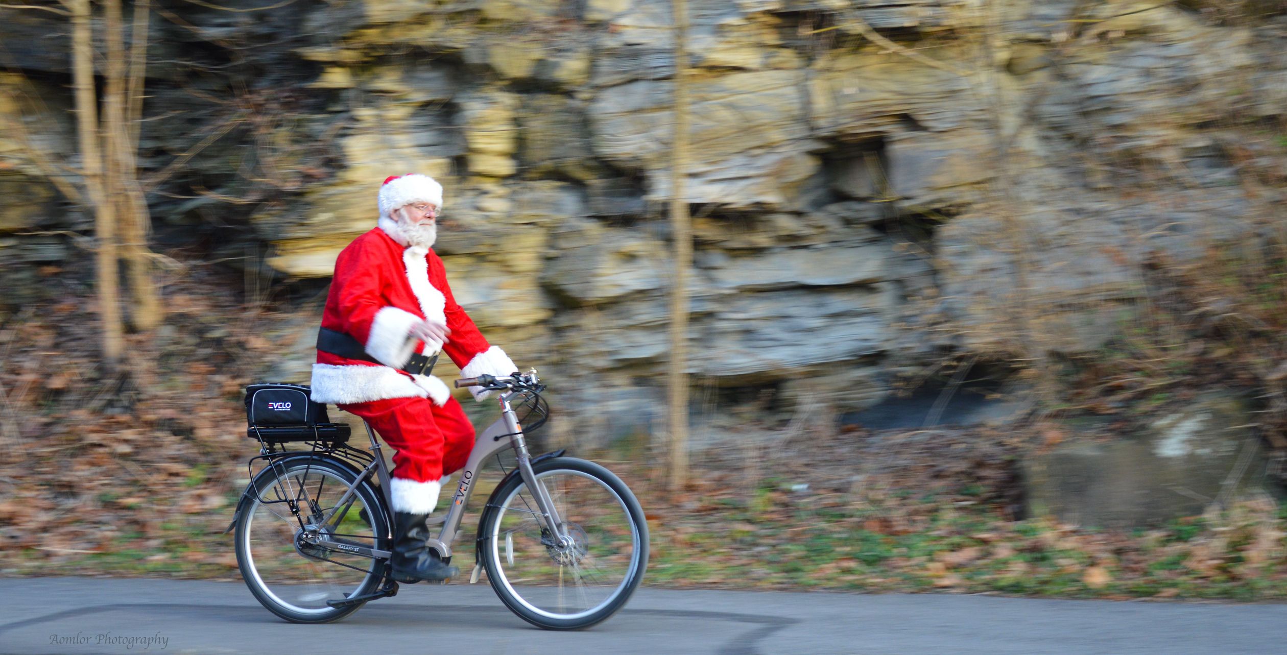 Sta Claus Ride Santa Claus Riding Bicycle Past Cliff · Free Stock Photo