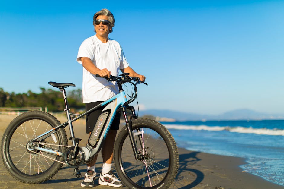 A Man at the Beach with His Electric Bike