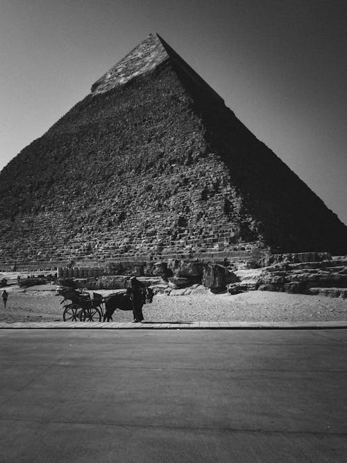 A black and white photo of a large pyramid