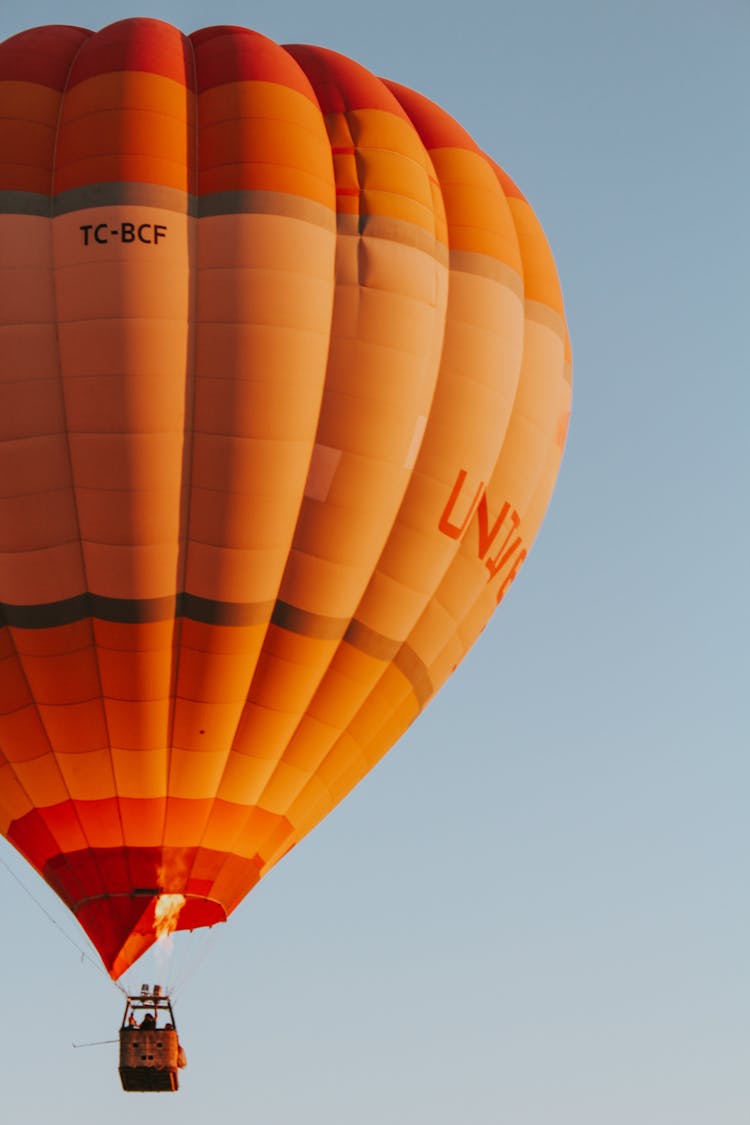 Orange Hot Air Balloon Among Blue Sky