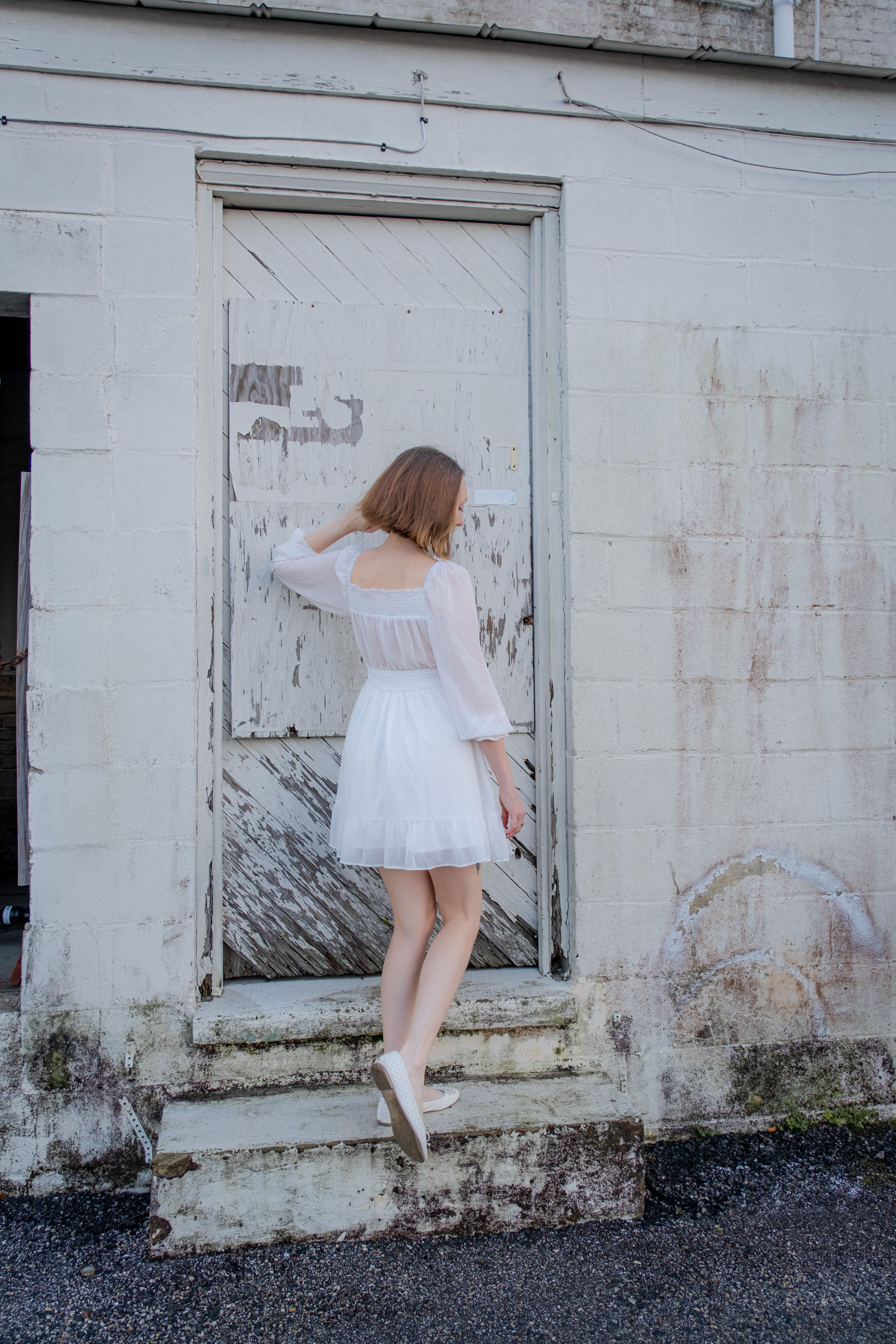Woman in White Dress Standing beside White Door · Free Stock Photo