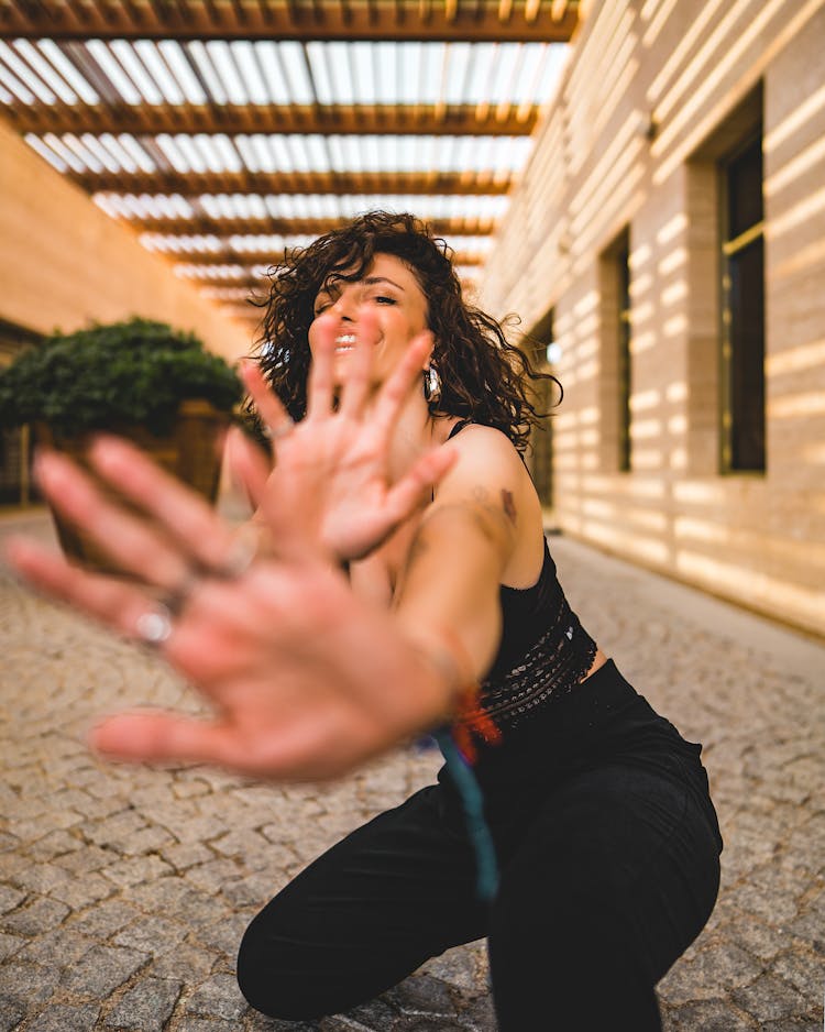 Crouching Woman With Outstretched Hands