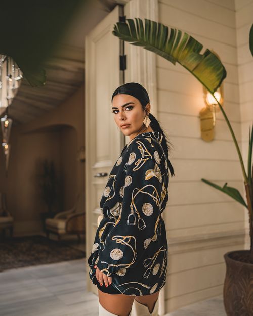 Free Model posing in a luxury Istanbul venue wearing a stylish dress, exuding elegance and sophistication. Stock Photo