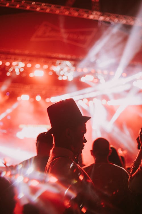 Side Profile of a Man wearing Hat in a Concert 