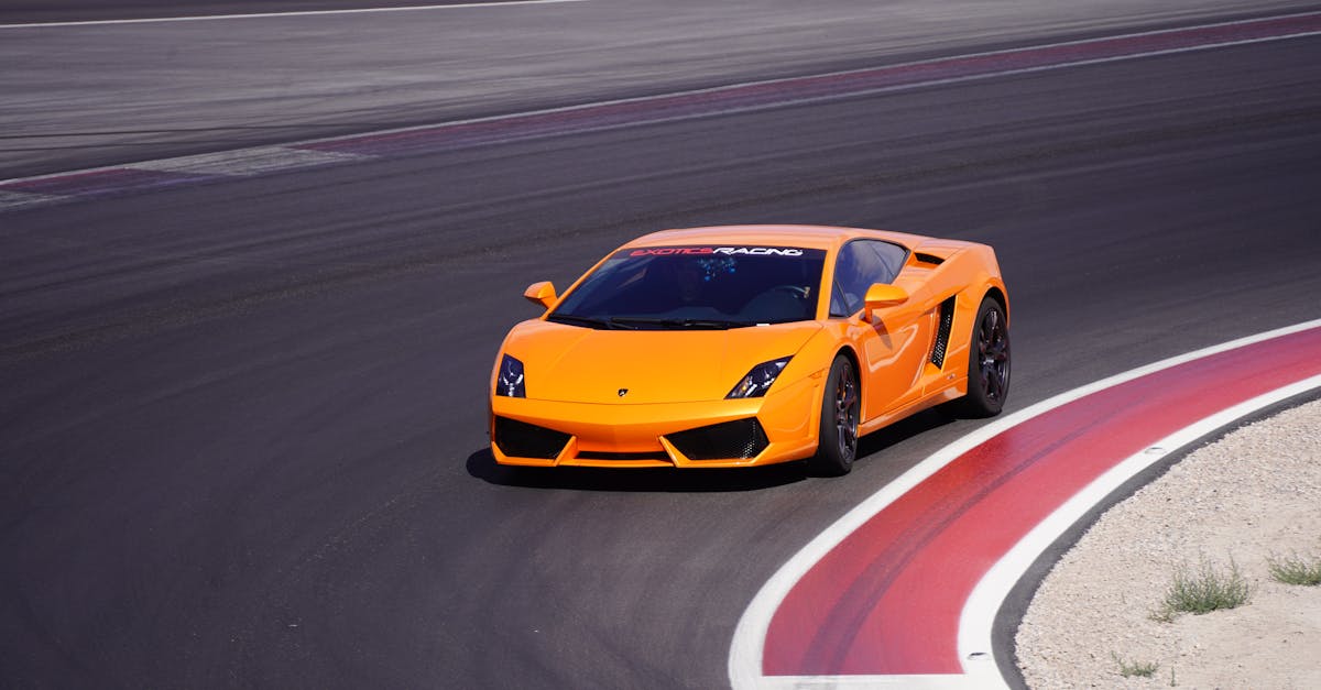 Orange Racing Car on Track · Free Stock Photo