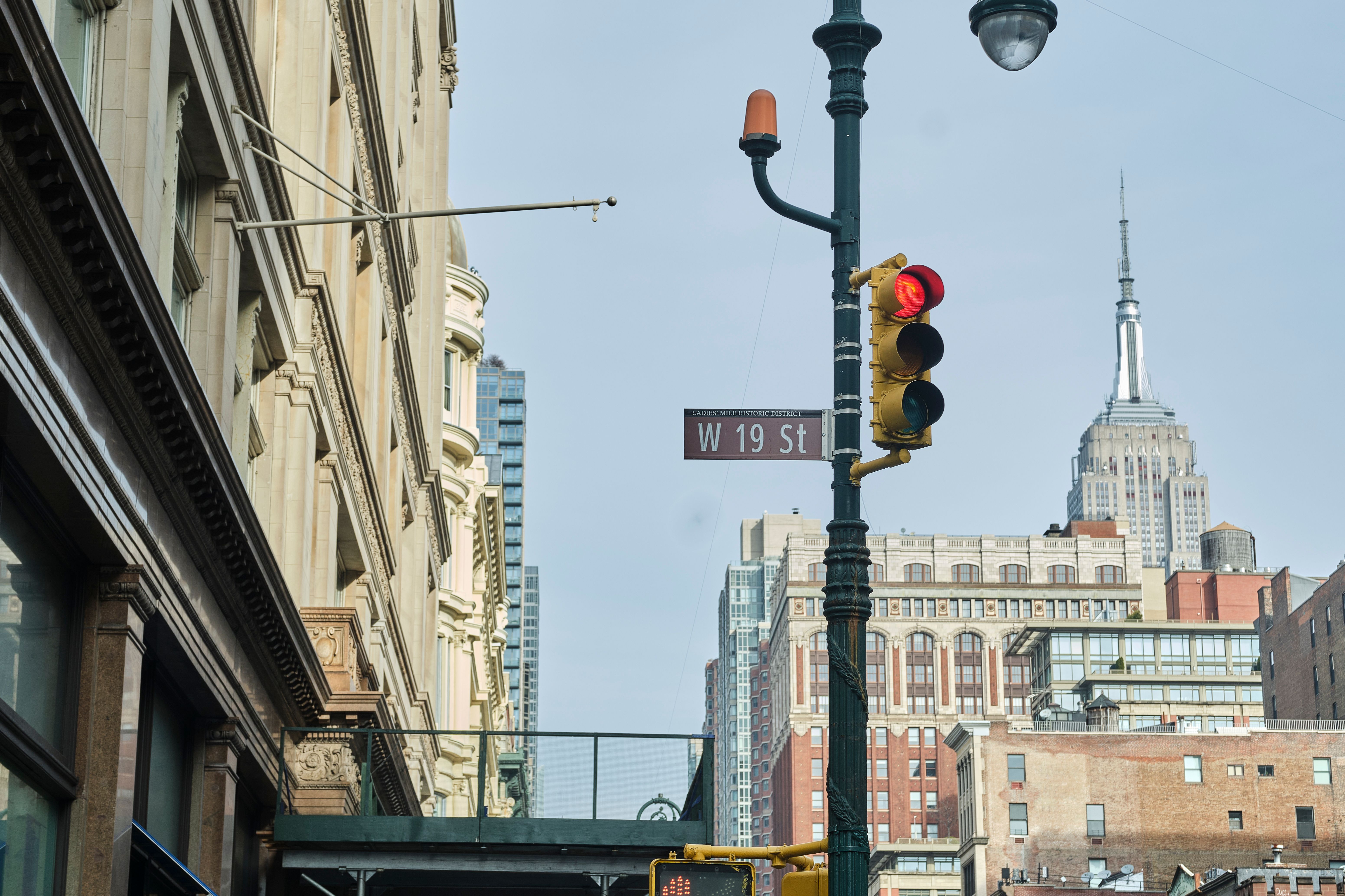 Hanging Street Name Beside the Stop Light · Free Stock Photo