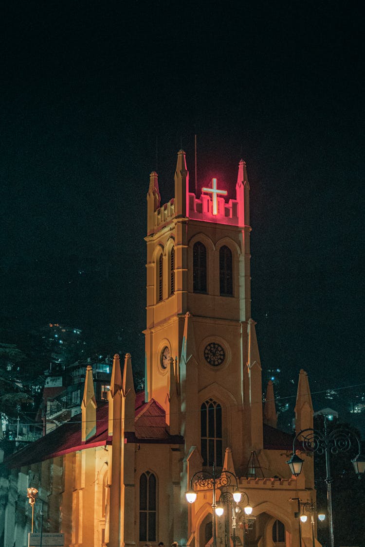 Illuminated Church Tower With Pink Neon At Night