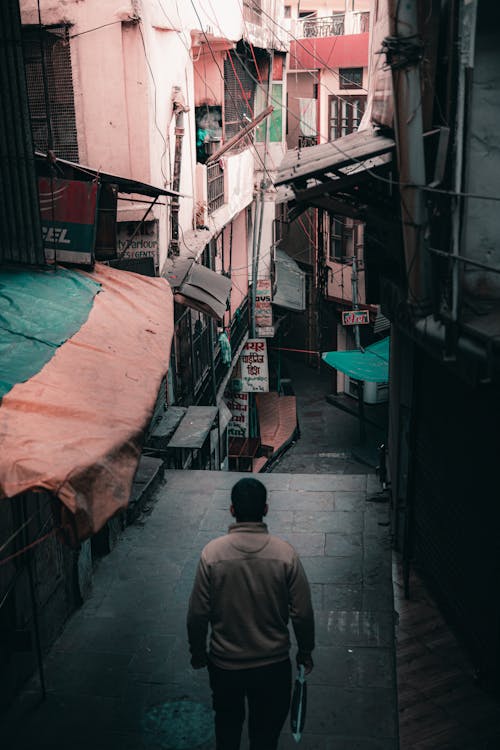 A Man Walking in a City 