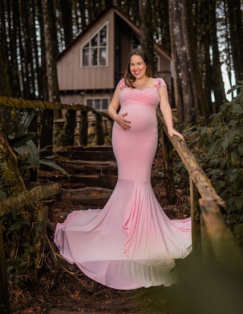 A Pregnant Woman in a Pink Dress 