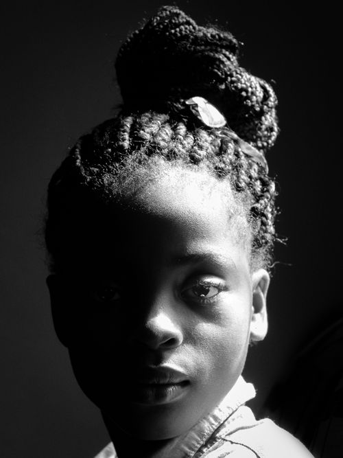 Free Elegant black and white close-up portrait of a woman with braided hair. Stock Photo