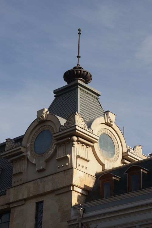 Free Low angle view of ornate architectural details on a historic building facade. Stock Photo