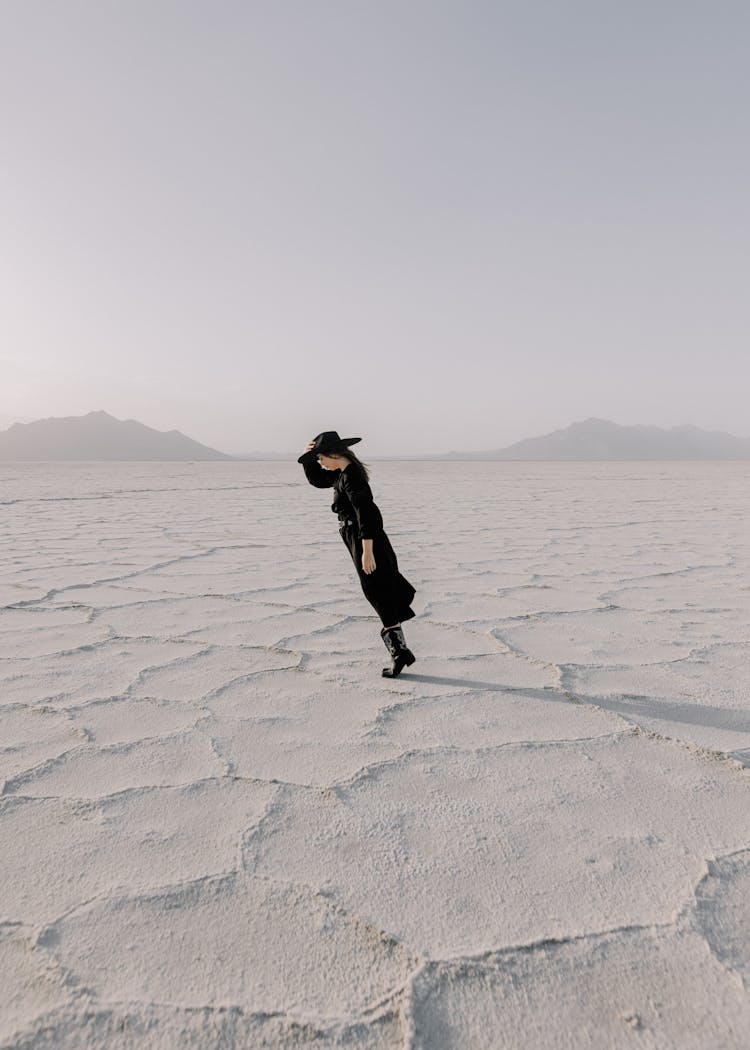 Woman In Black Posing In Salt Flats Utah, USA