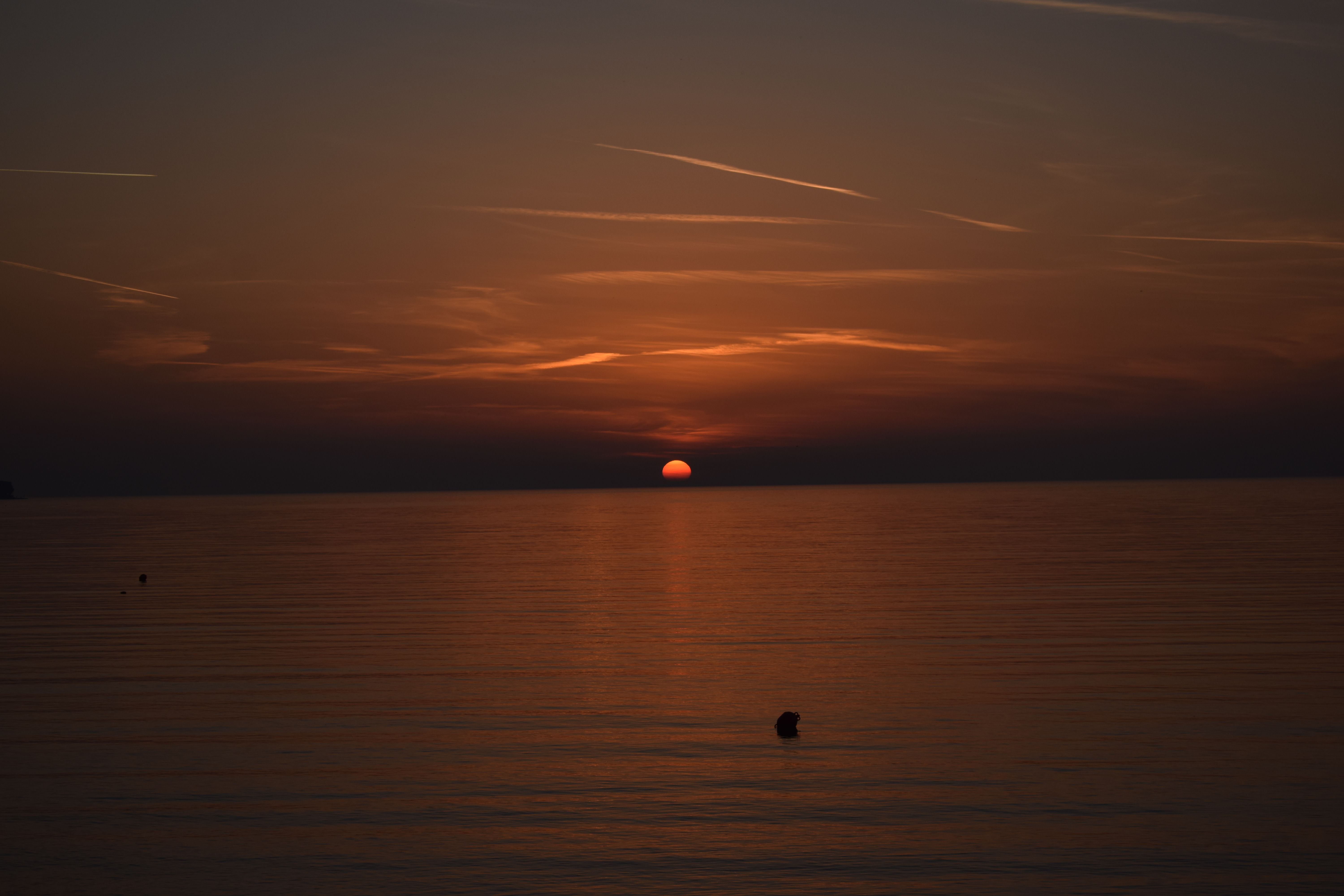 Yellow Sky over Sea at Sunset · Free Stock Photo