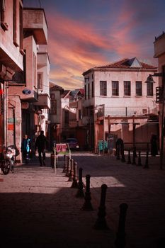 Explore the historic charm of Gaziantep's old town street at sunset with warm hues.