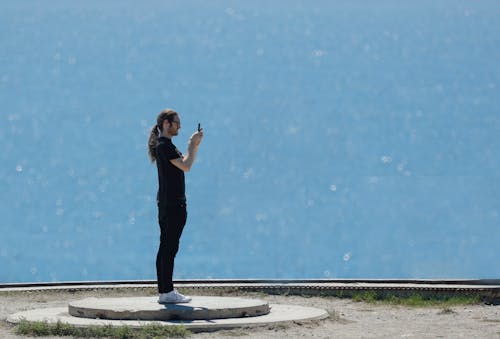 Man Taking a Picture using a Smartphone