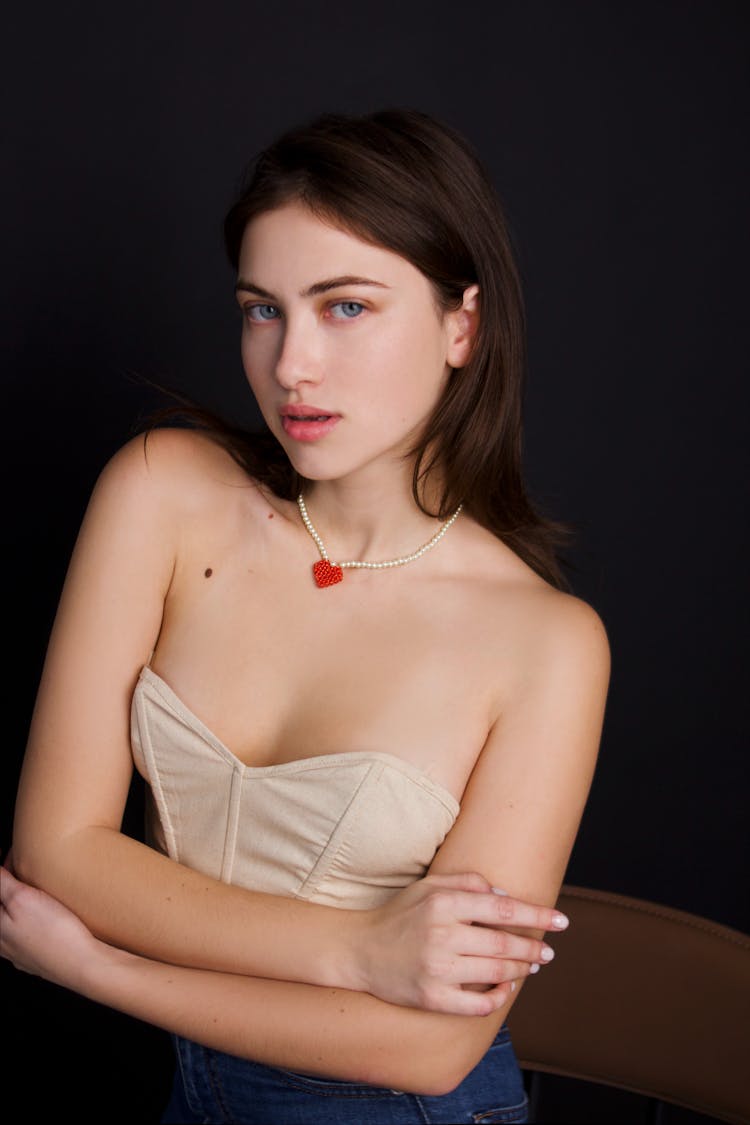 Young Woman Wearing A Heart Necklace 