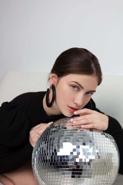 Beautiful Woman Posing with Disco Ball