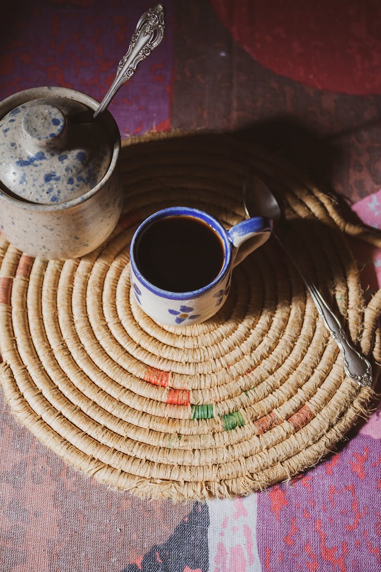 Cup Of Coffee Over A Place Mat