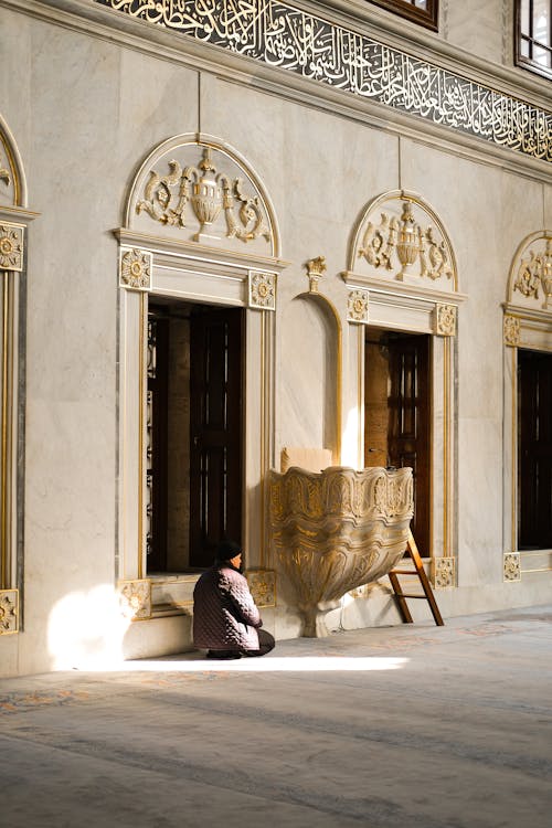 Woman Sitting in Mosque