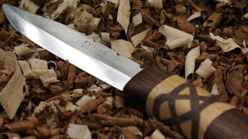 Knife on Top of wood Shavings