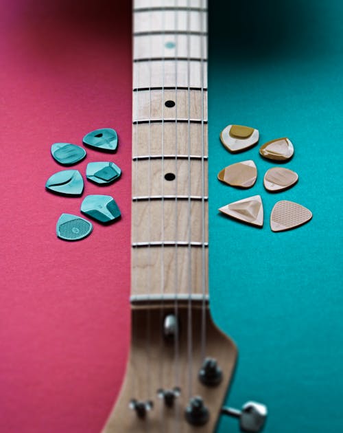 Guitar Picks and a Guitar 