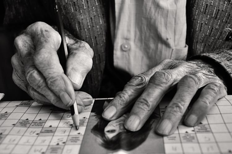 Elderly Man Solving Crossword