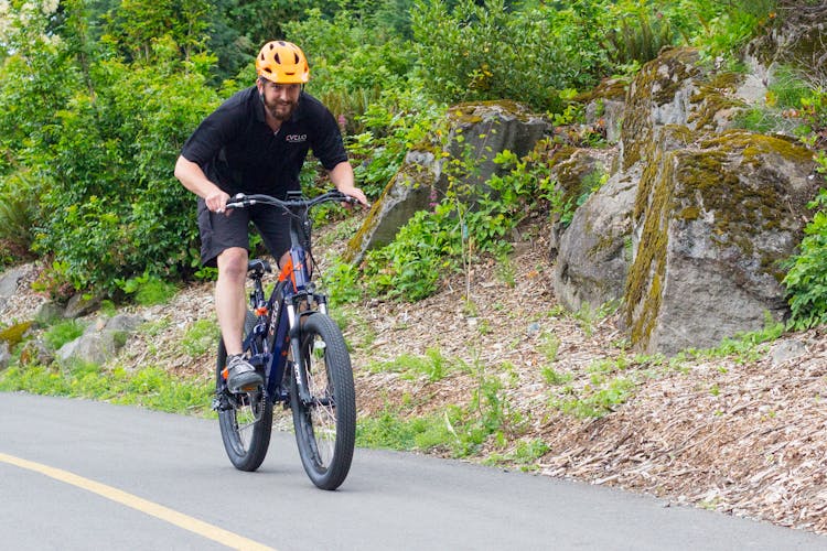 A Man Riding A Bike 