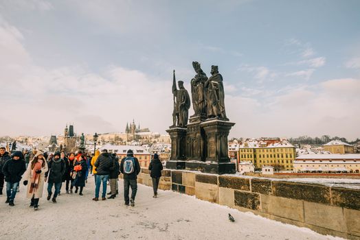 Charles Bridge at sunrise with a photographer — Prague
