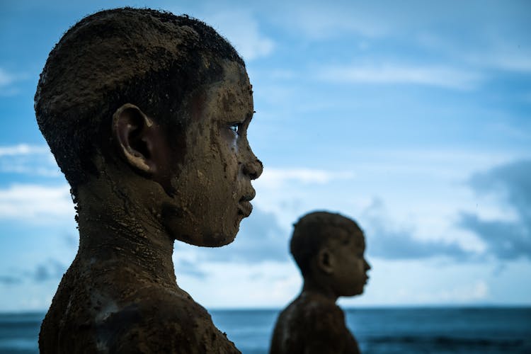 Mud On Children Face