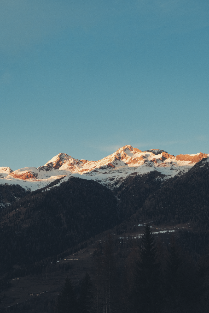 Beautiful sunset over snow capped Dolomites in Trentino-Alto Adige, perfect landscape wallpaper.