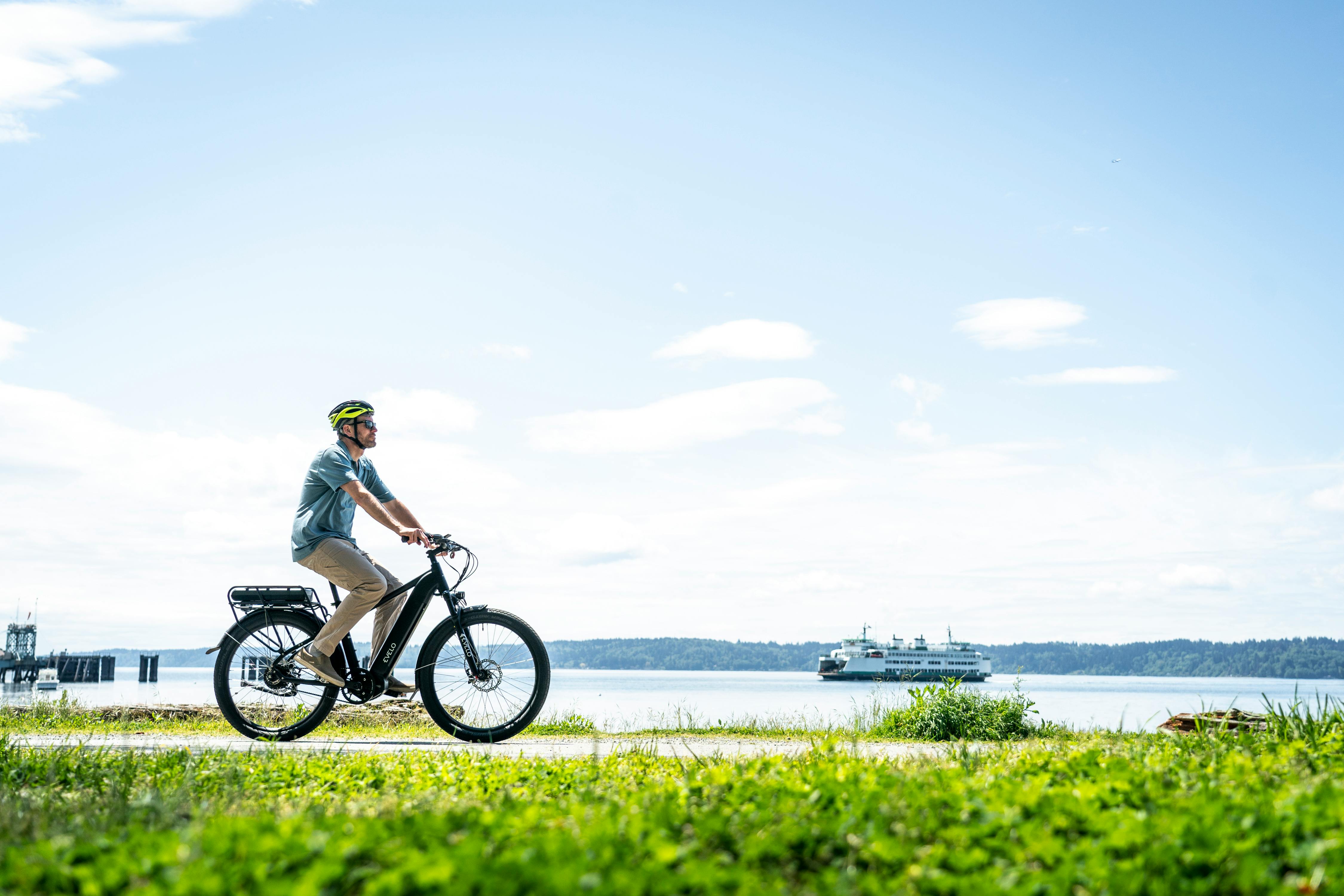 a man riding an electric bike on a grassy field