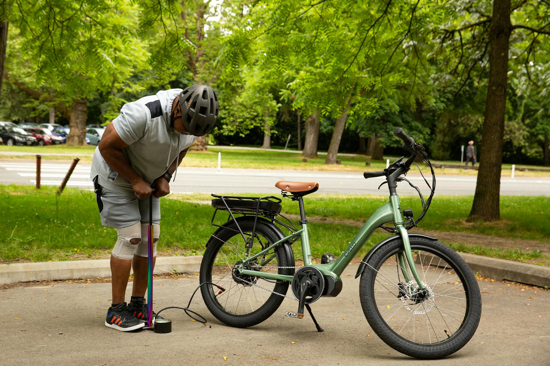 A man is using a bike to charge it
